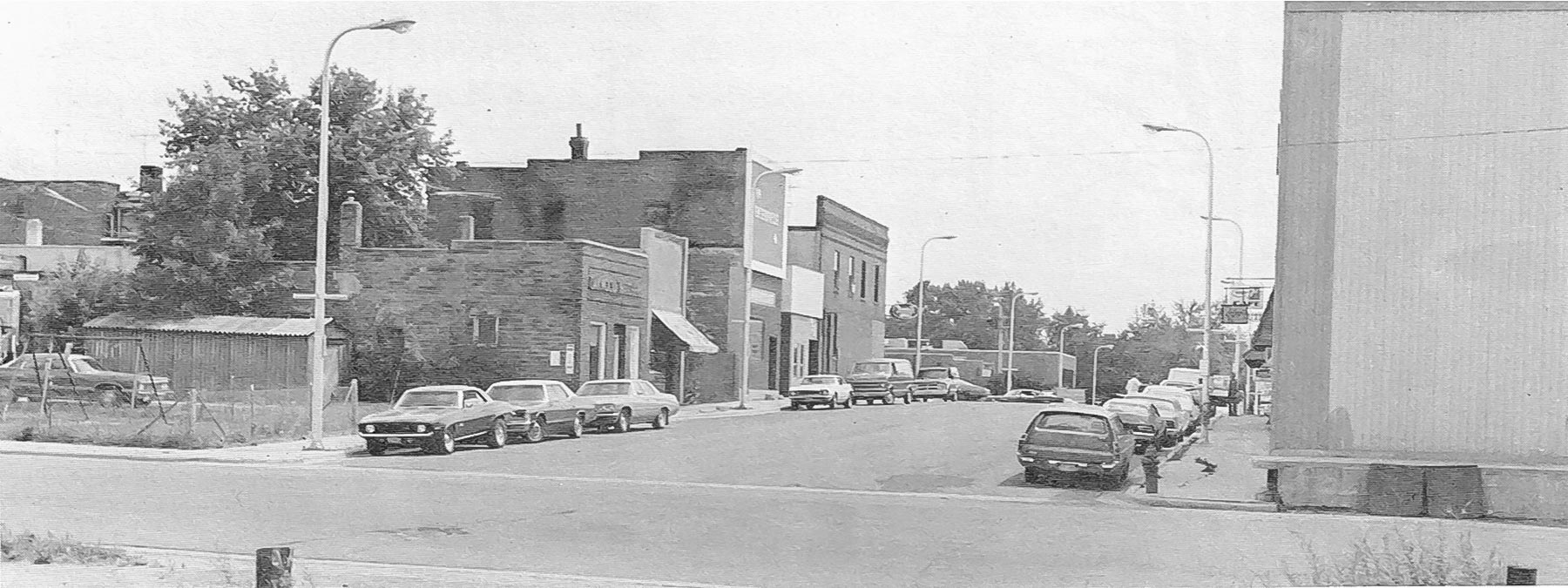 Picture of Millard Avenue looking south fro rail road tracks, 1976.